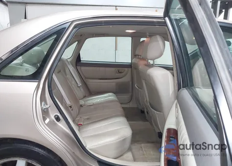 2001 Toyota Avalon Xls z USA, uszkodzony, nr VIN 4T1BF28B71U156440